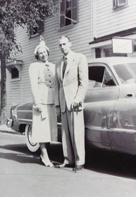 Tommy and Catherine Hartnett in front of their first office at 94 Broad St. in 1950.