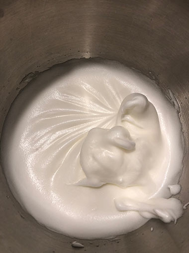 Egg whites reaching the stiff peak stage