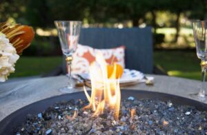 'Party Tips' photo with elegant glasses around an open flame.