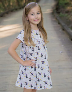A tween filr in a dress on sale at Southern Belles, a Children's Clothier & Shoes, too!