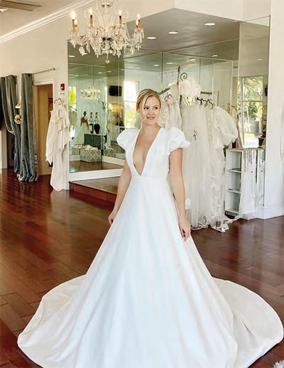 A happy bride saying yes to the dress at White on Daniel Island.