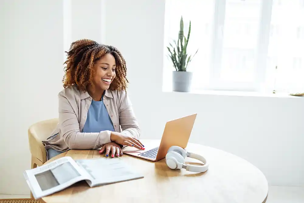 Awoman working from home on her computer