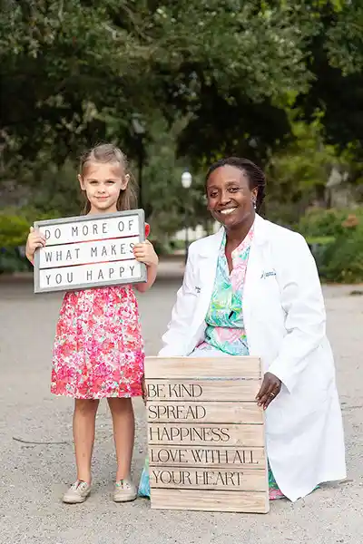 Dr. June Murakaru with a young patient