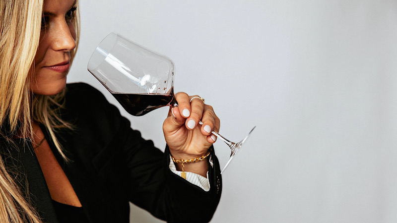 Photo of Ellen Rigas Enjoying A Glass Of Wine