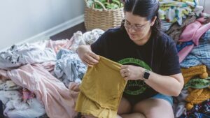 This image displays Ashley Houston helping a client for her brand “Your Household Hero”