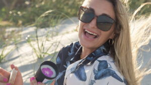 This image displays Jennifer Taylor holding a candle