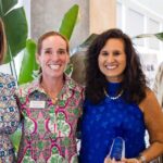 This image displays four people, who are honorees of the W.I.S.H. Society